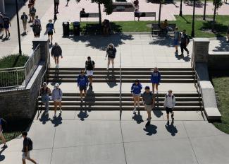 Students walking in POT plaza