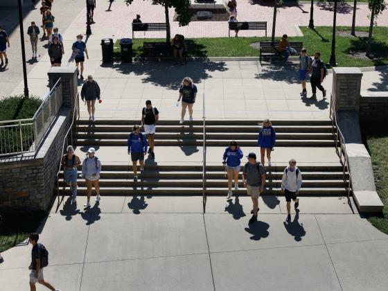 Students walking in POT plaza